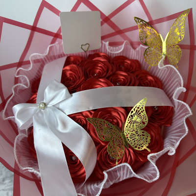 Red satin rose bouquet with white ribbon and gold butterfly accents