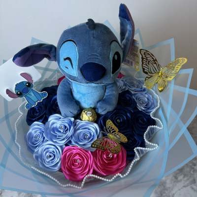 Blue plush character bouquet with satin roses and butterfly accents