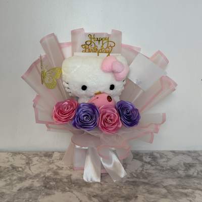 Hello Kitty plush bouquet with pink and purple roses and a birthday topper