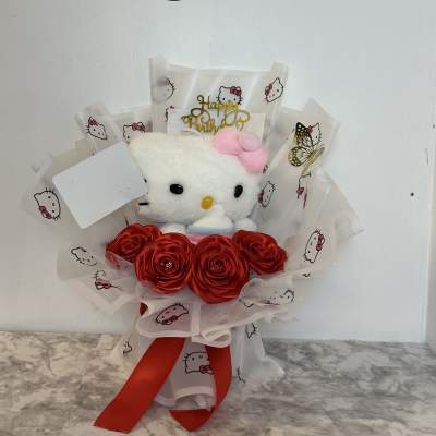 Hello Kitty plush bouquet with red satin roses and a birthday topper