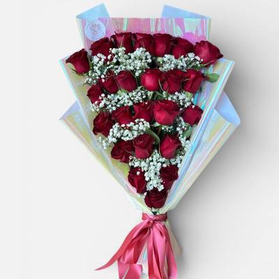 Bouquet of red roses with white baby's breath in iridescent wrap