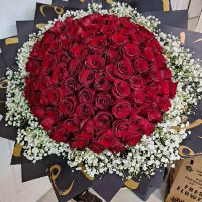 Large bouquet of red roses with white baby's breath