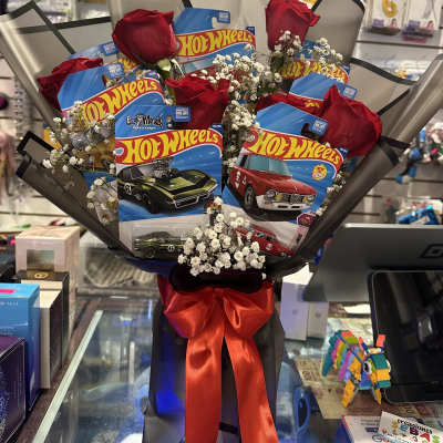 Bouquet of red roses with Hot Wheels toy cars and a red ribbon