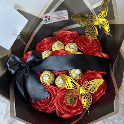 Bouquet of red satin roses with Ferrero Rocher chocolates and gold butterfly picks