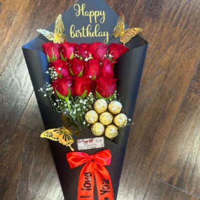 Elegant bouquet of 12 roses with black wrapping