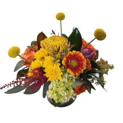 Bouquet of yellow, orange, and purple flowers in a vase