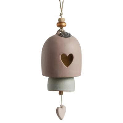 Hanging ceramic bell ornament with a heart cutout and bead accents