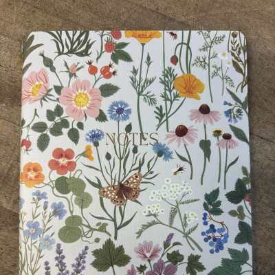 Floral-patterned notebook with the word NOTES on the cover