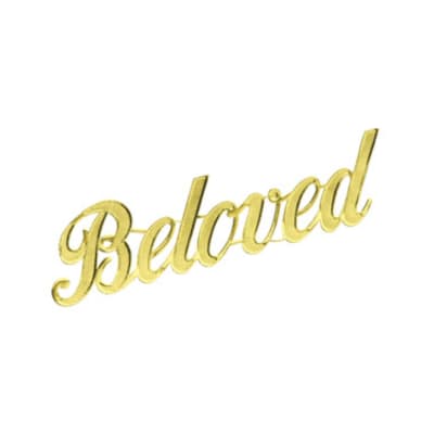 Gold script sign reading "Beloved"