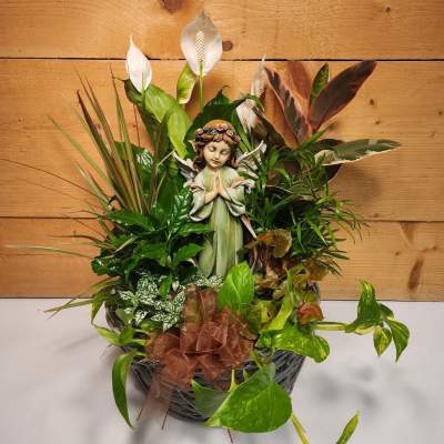 Basket arrangement with a figurine angel and white peace lilies