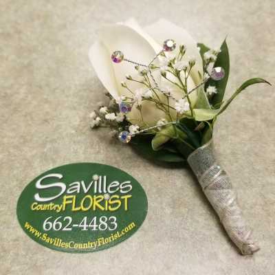 White calla lily boutonniere with baby's breath and jeweled wire accents