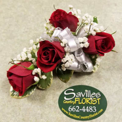 Four red roses with baby's breath and a silver ribbon