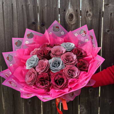 Pink glitter rose bouquet wrapped in Hello Kitty paper