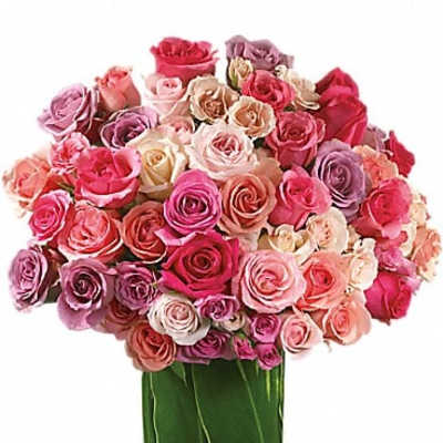 Large bouquet of pink and lavender roses in a green vase