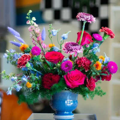Colorful mixed bouquet in a blue vase