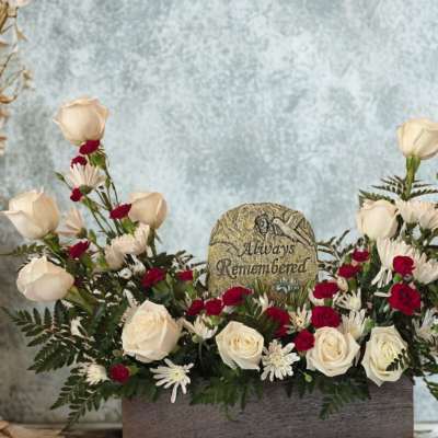 White and red rose arrangement with a memorial stone centerpiece