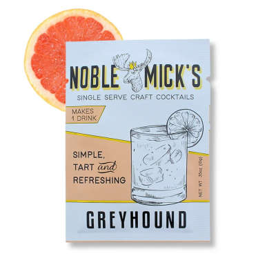 Greyhound cocktail mix box with a grapefruit slice behind it