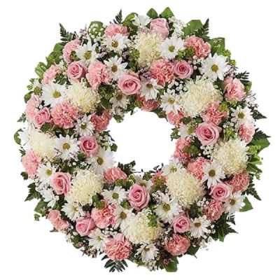 Pink and white floral wreath with roses, carnations, and daisies