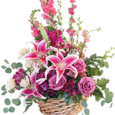 Pink lilies and roses in a woven basket