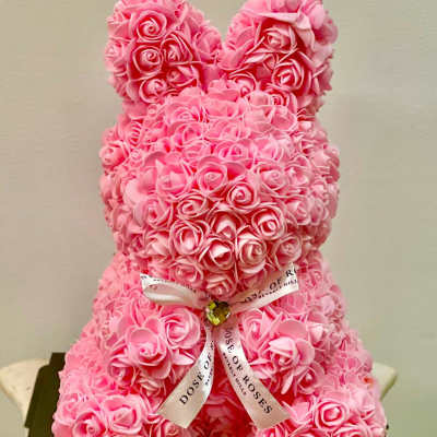 Pink rose teddy bear with a ribbon bow