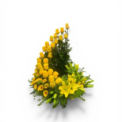 Asymmetrical arrangement of yellow roses, lilies, and mums in a crescent shape.