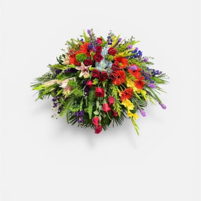 Renoir’s Touch of Vibrancy Casket Piece by Petal Perfection Flower Company