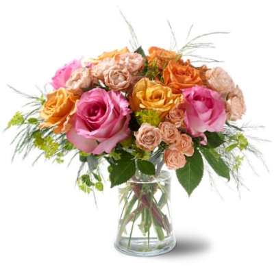 Bouquet of pink, peach, and orange roses in a clear glass vase