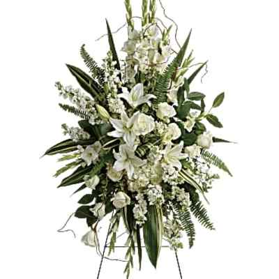 White floral standing spray on an easel