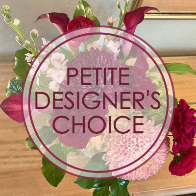 Pink and burgundy floral arrangement with calla lilies and chrysanthemums