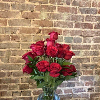 Bouquet of red roses in a clear glass vase