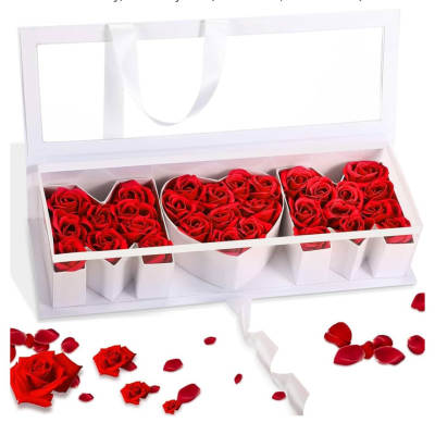 Red roses arranged in a white heart-shaped gift box