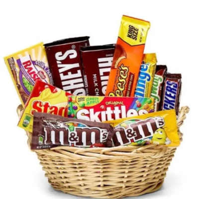 Basket filled with assorted candy bars and sweets