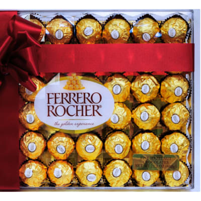 Large box of gold-wrapped chocolates with a red ribbon and bow across the front