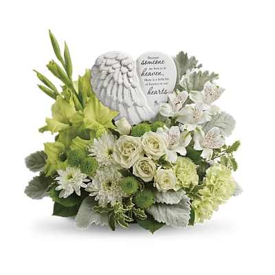 Sympathy arrangement of white and green flowers with an angel wing heart keepsake plaque.