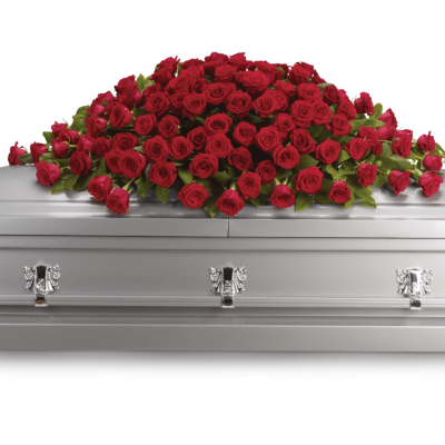 Red roses arranged on a silver casket