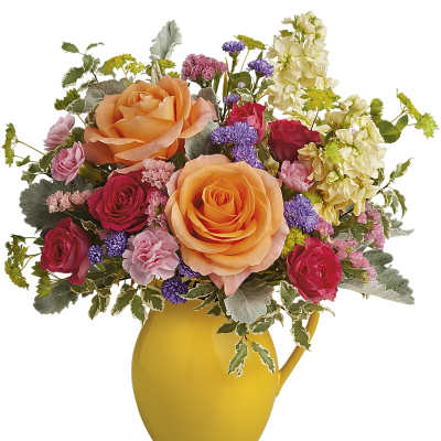 Mixed bouquet of roses and small purple flowers in a yellow pitcher vase
