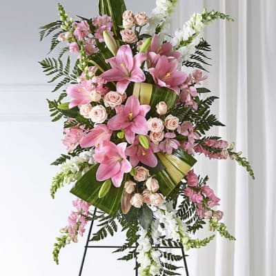 Tall pink and white floral standing spray on an easel
