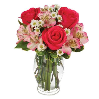 Pink roses and alstroemeria in a clear glass vase