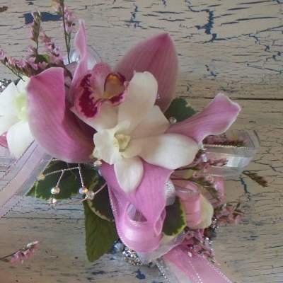 Pink and white orchid corsage with ribbon and rhinestone accents