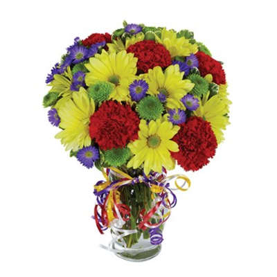 Bouquet of yellow daisies, red carnations, and purple asters in a glass vase