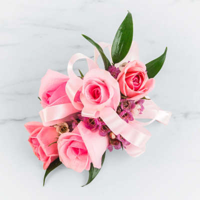 Pink rose bouquet with a pale pink ribbon and purple filler flowers