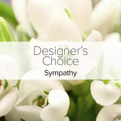 White flowers with a "Designer’s Choice Sympathy" label