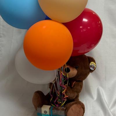 Birthday balloon bouquet with a teddy bear and candy box