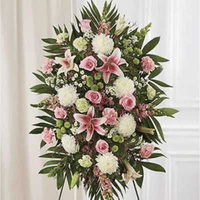 Standing floral spray with pink lilies, roses, and white blooms