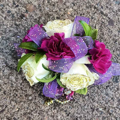 Small corsage with white and magenta roses and purple ribbon