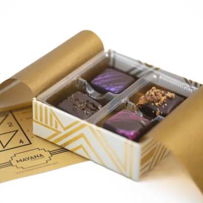 Box of assorted chocolates with gold wrapping