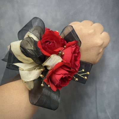 Red black gold corsage