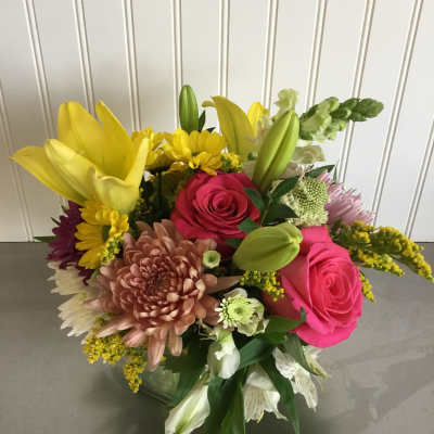 Mixed bouquet with pink roses, yellow lilies, and chrysanthemums
