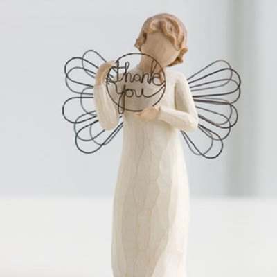 Angel figurine holding a "thank you" sign