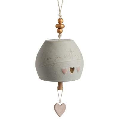 Ceramic hanging ornament with heart cutouts and a dangling heart charm